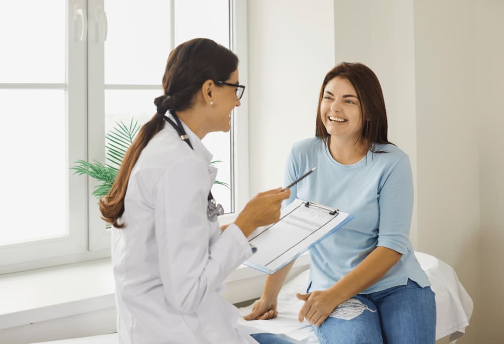 A private clinic consultant reviewing patient feedback on a desktop dashboard