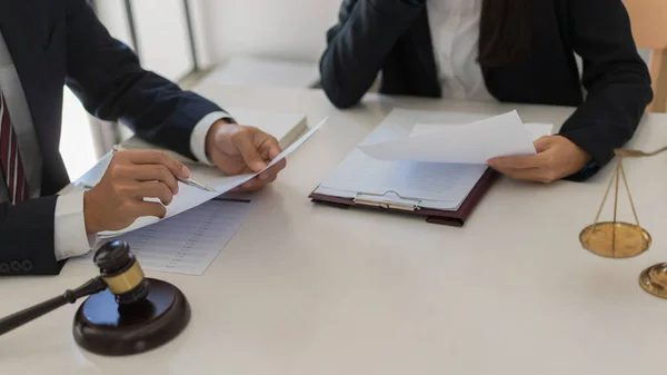 A law-firm partner reviewing client feedback in a modern office
