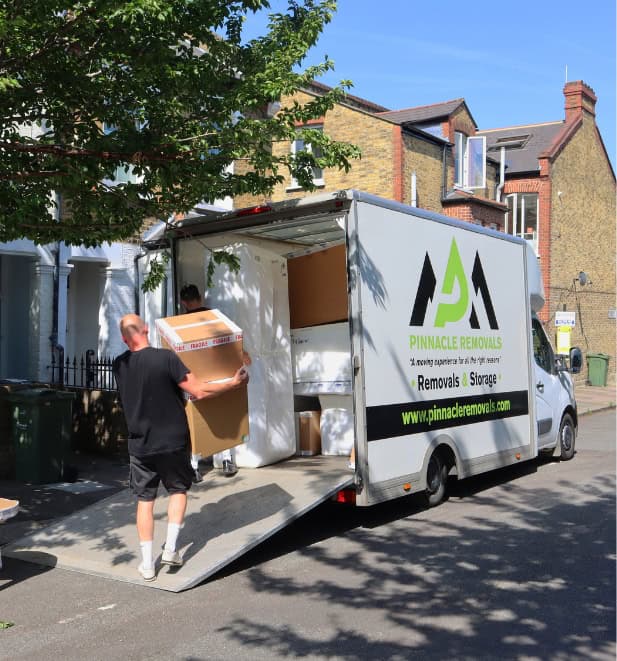 A British Association of Removers crew loading a customer's belongings into a moving lorry